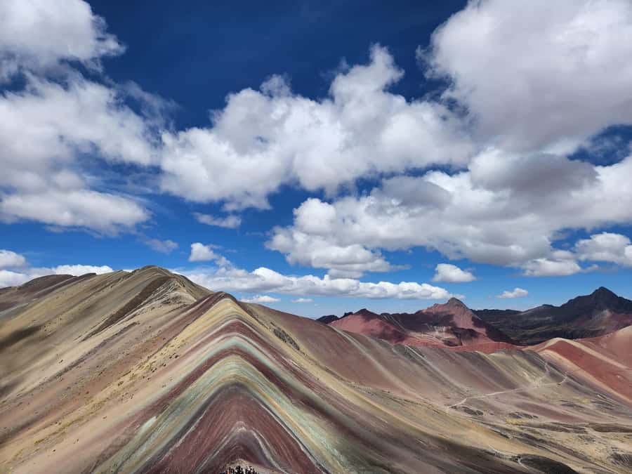 From Cusco: Full Day tour to Rainbow mountain and Red Valley - The descent and buffet lunch in Cusipata