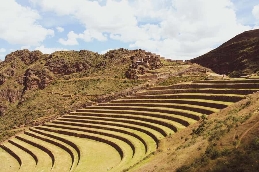 From Cusco: Sacred Valley ending in Ollantaytambo and Lunch - Pisac: terraces, stonework, and a high mountain setting